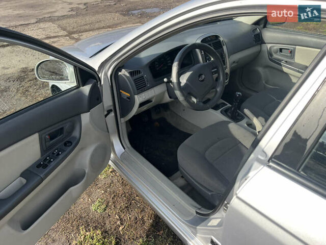 Серый Киа Черато, объемом двигателя 1.49 л и пробегом 257 тыс. км за 4400 $, фото 7 на Automoto.ua