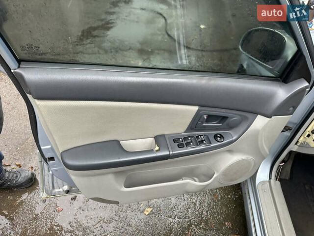 Сірий Кіа Черато, об'ємом двигуна 2 л та пробігом 280 тис. км за 2100 $, фото 13 на Automoto.ua