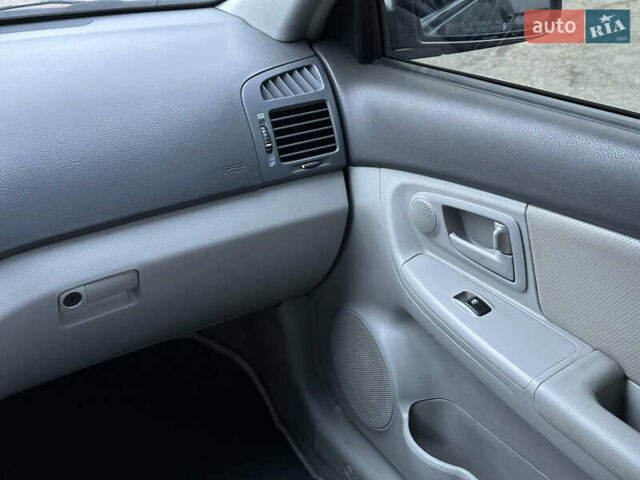 Серый Киа Черато, объемом двигателя 1.98 л и пробегом 213 тыс. км за 4900 $, фото 22 на Automoto.ua