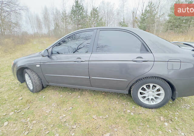 Серый Киа Черато, объемом двигателя 2 л и пробегом 180 тыс. км за 3800 $, фото 9 на Automoto.ua