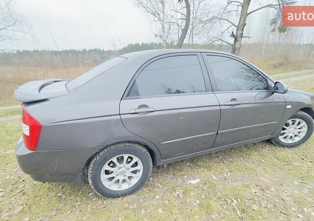 Серый Киа Черато, объемом двигателя 2 л и пробегом 180 тыс. км за 3800 $, фото 5 на Automoto.ua