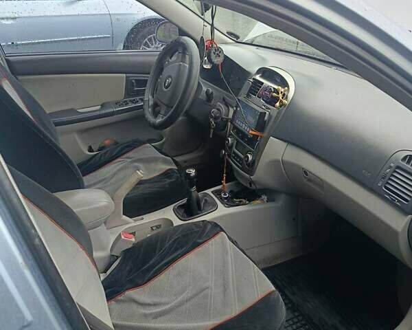 Серый Киа Черато, объемом двигателя 2 л и пробегом 260 тыс. км за 3000 $, фото 6 на Automoto.ua