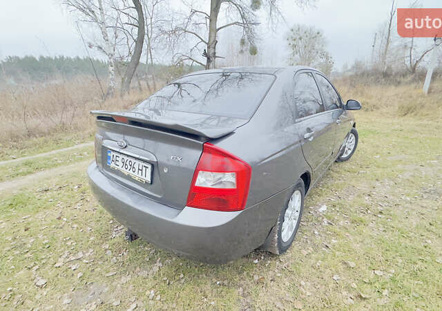 Серый Киа Черато, объемом двигателя 2 л и пробегом 180 тыс. км за 3800 $, фото 6 на Automoto.ua