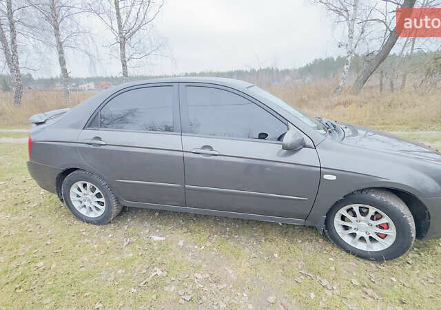 Серый Киа Черато, объемом двигателя 2 л и пробегом 180 тыс. км за 3800 $, фото 4 на Automoto.ua
