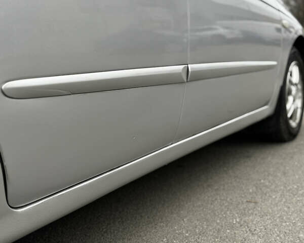 Серый Киа Черато, объемом двигателя 2 л и пробегом 240 тыс. км за 4300 $, фото 4 на Automoto.ua