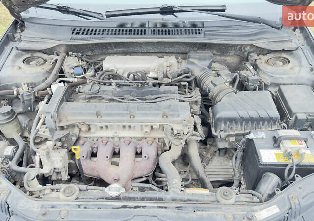 Серый Киа Черато, объемом двигателя 2 л и пробегом 180 тыс. км за 3800 $, фото 2 на Automoto.ua