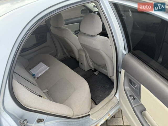 Сірий Кіа Черато, об'ємом двигуна 2 л та пробігом 184 тис. км за 2999 $, фото 13 на Automoto.ua