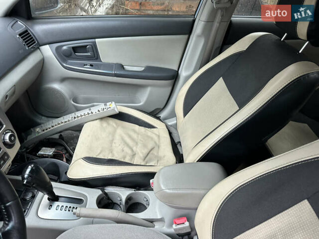 Сірий Кіа Черато, об'ємом двигуна 2 л та пробігом 280 тис. км за 2100 $, фото 18 на Automoto.ua