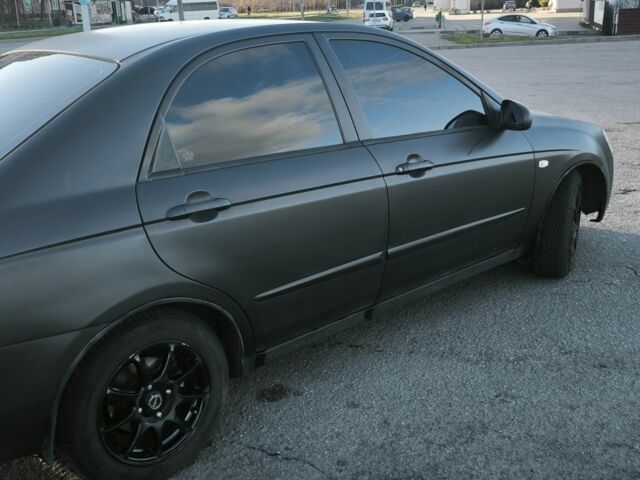 Серый Киа Черато, объемом двигателя 2 л и пробегом 310 тыс. км за 3200 $, фото 1 на Automoto.ua