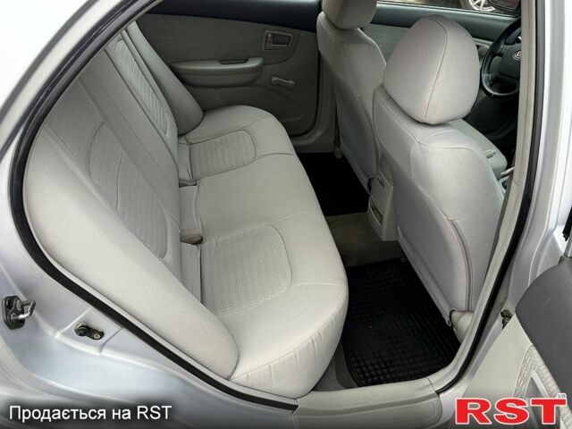 Серый Киа Черато, объемом двигателя 1.6 л и пробегом 250 тыс. км за 4200 $, фото 10 на Automoto.ua