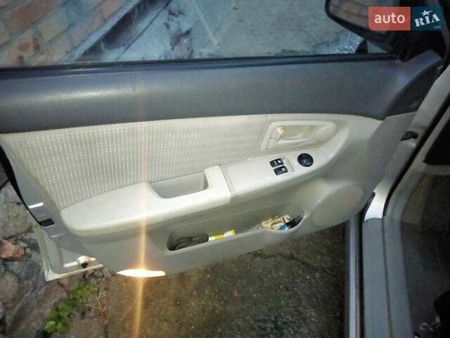 Серый Киа Черато, объемом двигателя 1.58 л и пробегом 170 тыс. км за 4500 $, фото 3 на Automoto.ua