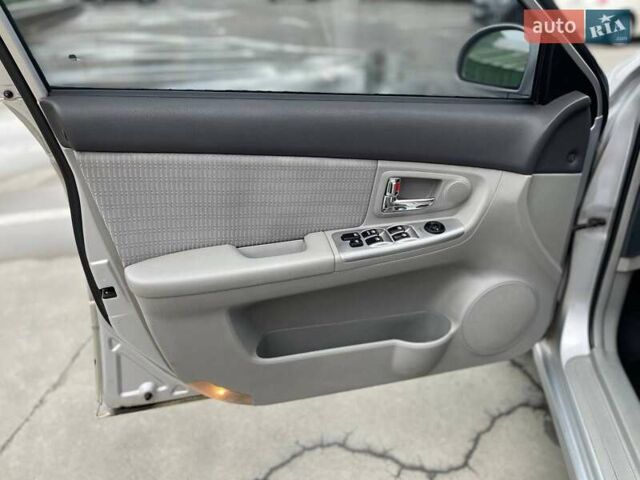 Серый Киа Черато, объемом двигателя 2 л и пробегом 183 тыс. км за 4000 $, фото 12 на Automoto.ua