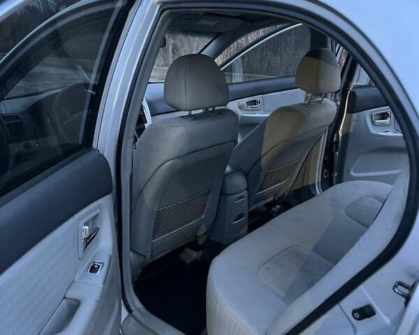 Серый Киа Черато, объемом двигателя 2 л и пробегом 326 тыс. км за 4200 $, фото 9 на Automoto.ua