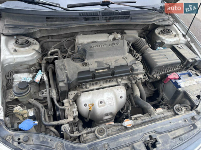 Серый Киа Черато, объемом двигателя 2 л и пробегом 160 тыс. км за 4500 $, фото 10 на Automoto.ua