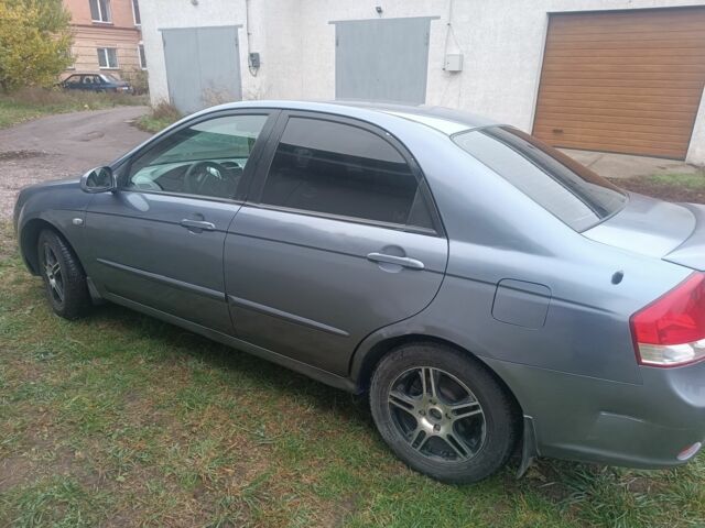 Серый Киа Черато, объемом двигателя 2 л и пробегом 237 тыс. км за 3000 $, фото 4 на Automoto.ua