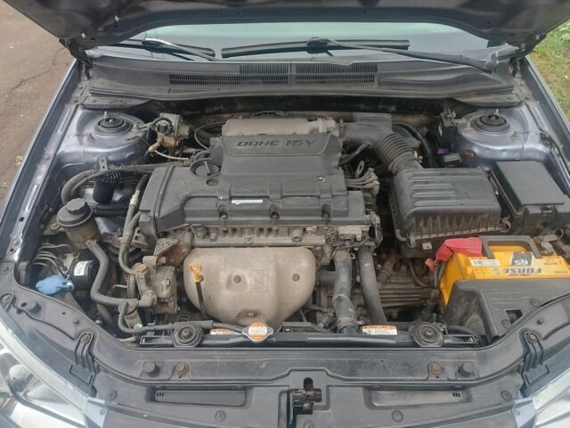 Серый Киа Черато, объемом двигателя 2 л и пробегом 237 тыс. км за 3000 $, фото 6 на Automoto.ua