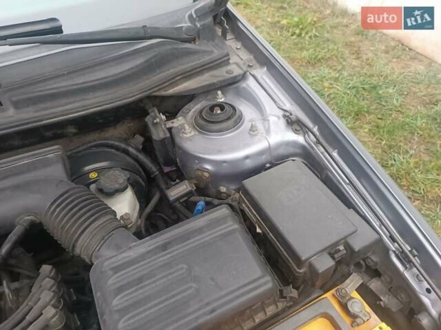 Серый Киа Черато, объемом двигателя 1.98 л и пробегом 230 тыс. км за 3000 $, фото 6 на Automoto.ua