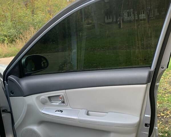 Сірий Кіа Черато, об'ємом двигуна 2 л та пробігом 199 тис. км за 5099 $, фото 4 на Automoto.ua