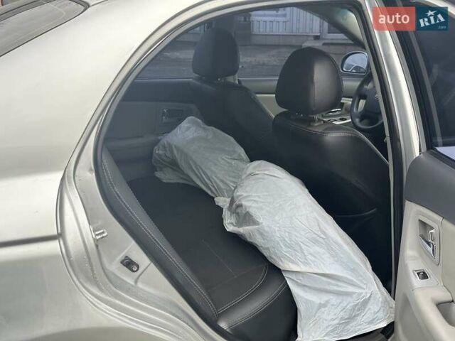 Серый Киа Черато, объемом двигателя 1.98 л и пробегом 188 тыс. км за 4990 $, фото 22 на Automoto.ua