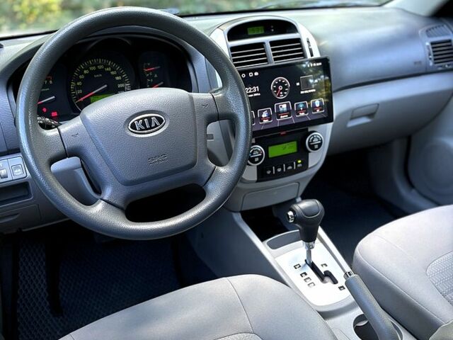 Серый Киа Черато, объемом двигателя 2 л и пробегом 215 тыс. км за 4950 $, фото 7 на Automoto.ua