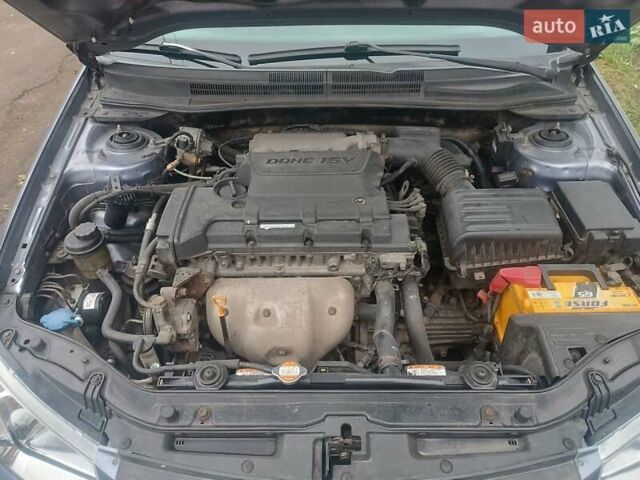 Серый Киа Черато, объемом двигателя 1.98 л и пробегом 230 тыс. км за 3000 $, фото 7 на Automoto.ua