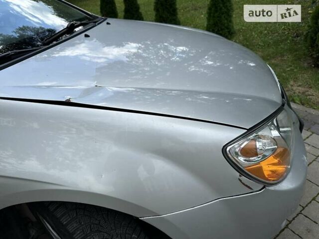 Сірий Кіа Черато, об'ємом двигуна 2 л та пробігом 257 тис. км за 3800 $, фото 12 на Automoto.ua