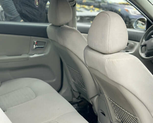 Серый Киа Черато, объемом двигателя 1.58 л и пробегом 495 тыс. км за 3900 $, фото 11 на Automoto.ua