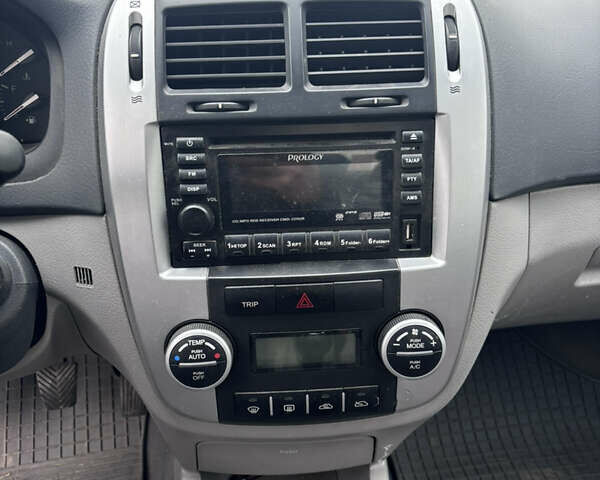 Серый Киа Черато, объемом двигателя 2 л и пробегом 160 тыс. км за 4500 $, фото 6 на Automoto.ua