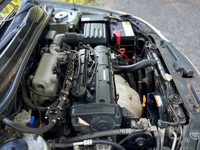 Серый Киа Черато, объемом двигателя 2 л и пробегом 215 тыс. км за 4950 $, фото 9 на Automoto.ua