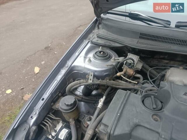 Серый Киа Черато, объемом двигателя 1.98 л и пробегом 230 тыс. км за 3000 $, фото 1 на Automoto.ua