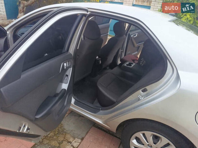 Сірий Кіа Черато, об'ємом двигуна 2 л та пробігом 235 тис. км за 6300 $, фото 18 на Automoto.ua