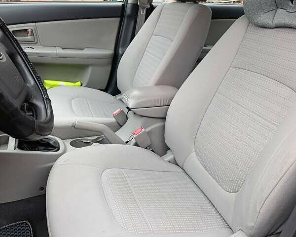 Серый Киа Черато, объемом двигателя 1.6 л и пробегом 200 тыс. км за 4100 $, фото 11 на Automoto.ua