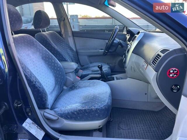 Синій Кіа Черато, об'ємом двигуна 2 л та пробігом 110 тис. км за 6390 $, фото 9 на Automoto.ua