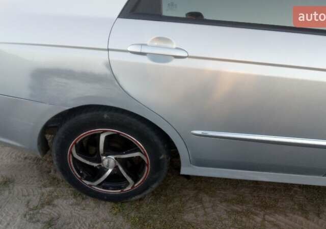 Синий Киа Черато, объемом двигателя 1.6 л и пробегом 250 тыс. км за 4500 $, фото 1 на Automoto.ua