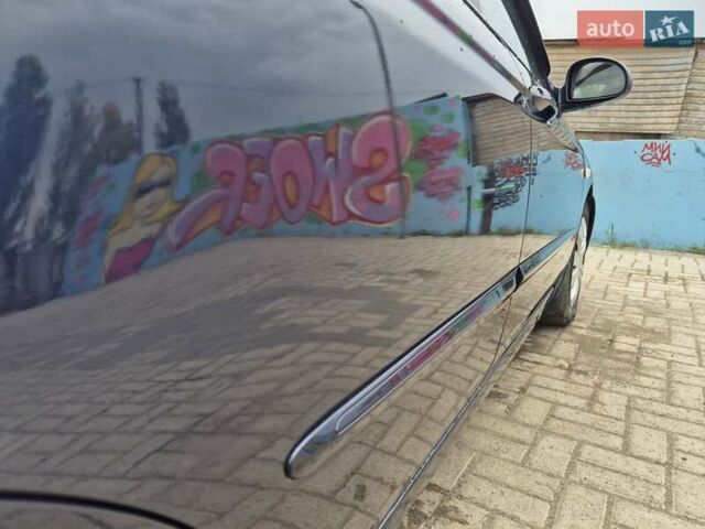 Синий Киа Черато, объемом двигателя 1.98 л и пробегом 252 тыс. км за 4200 $, фото 2 на Automoto.ua