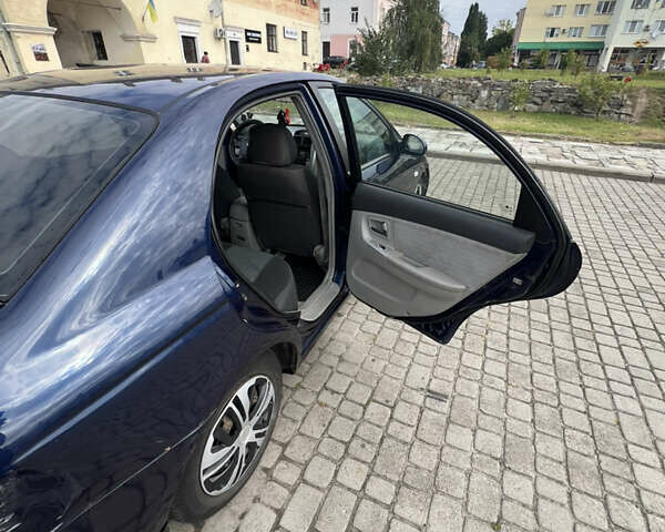 Синій Кіа Черато, об'ємом двигуна 1.6 л та пробігом 291 тис. км за 3500 $, фото 10 на Automoto.ua