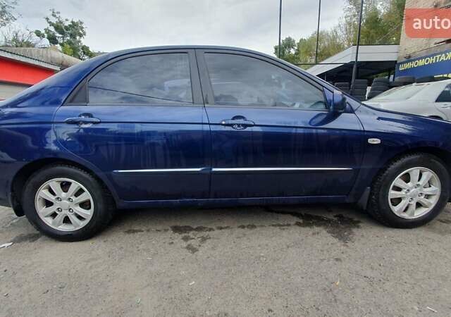 Синий Киа Черато, объемом двигателя 2 л и пробегом 233 тыс. км за 5100 $, фото 3 на Automoto.ua