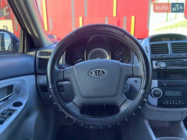Синій Кіа Черато, об'ємом двигуна 2 л та пробігом 110 тис. км за 6390 $, фото 13 на Automoto.ua