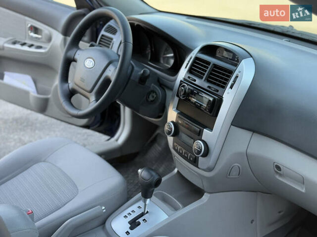 Синий Киа Черато, объемом двигателя 2 л и пробегом 190 тыс. км за 5799 $, фото 12 на Automoto.ua
