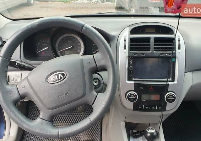 Синий Киа Черато, объемом двигателя 2 л и пробегом 233 тыс. км за 5100 $, фото 7 на Automoto.ua