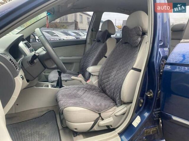 Синій Кіа Черато, об'ємом двигуна 2 л та пробігом 233 тис. км за 4690 $, фото 8 на Automoto.ua