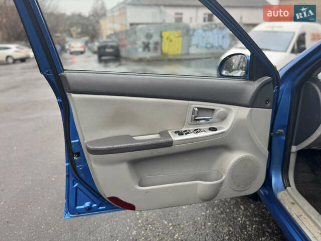 Синий Киа Черато, объемом двигателя 1.59 л и пробегом 258 тыс. км за 3000 $, фото 6 на Automoto.ua