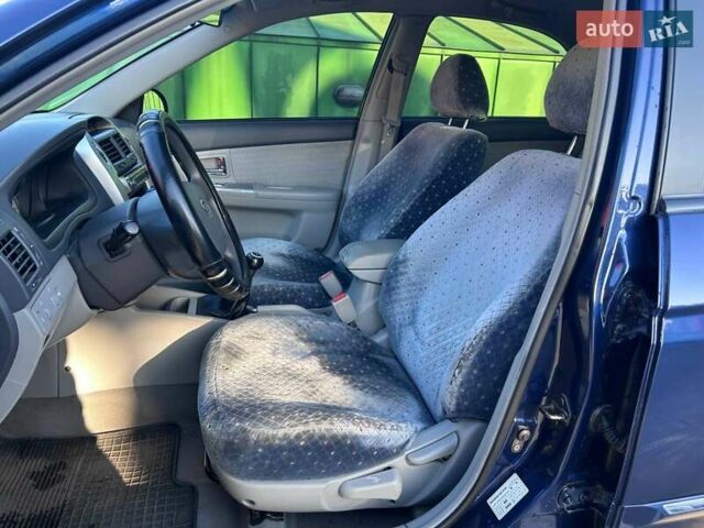 Синій Кіа Черато, об'ємом двигуна 2 л та пробігом 110 тис. км за 6390 $, фото 10 на Automoto.ua