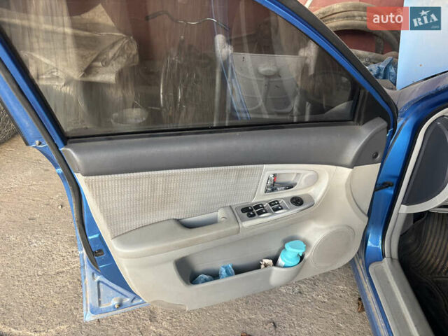 Синий Киа Черато, объемом двигателя 1.6 л и пробегом 140 тыс. км за 1400 $, фото 9 на Automoto.ua