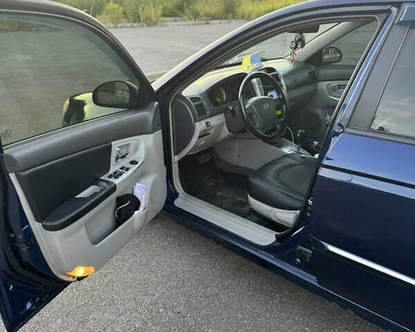 Синий Киа Черато, объемом двигателя 2 л и пробегом 258 тыс. км за 5500 $, фото 6 на Automoto.ua