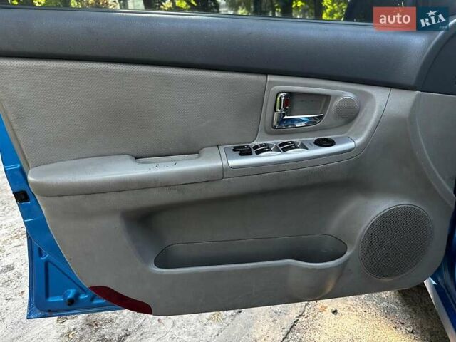Синій Кіа Черато, об'ємом двигуна 1.6 л та пробігом 248 тис. км за 5990 $, фото 8 на Automoto.ua