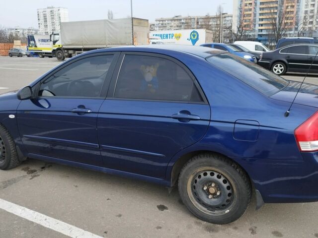 Синий Киа Черато, объемом двигателя 2 л и пробегом 253 тыс. км за 4900 $, фото 1 на Automoto.ua