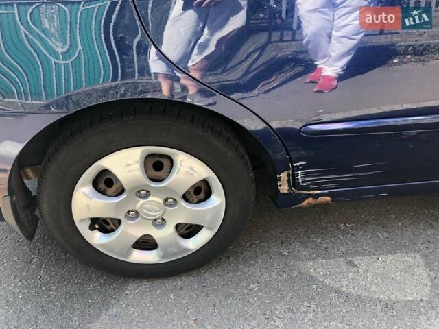 Синий Киа Черато, объемом двигателя 1.6 л и пробегом 292 тыс. км за 4400 $, фото 5 на Automoto.ua