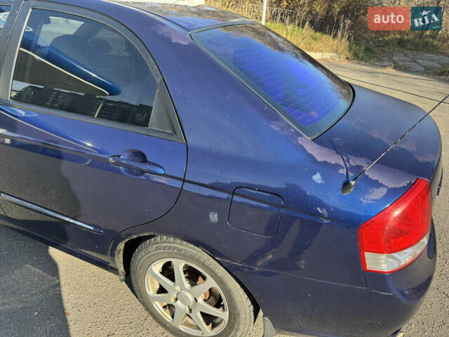 Синий Киа Черато, объемом двигателя 1.59 л и пробегом 250 тыс. км за 3100 $, фото 11 на Automoto.ua