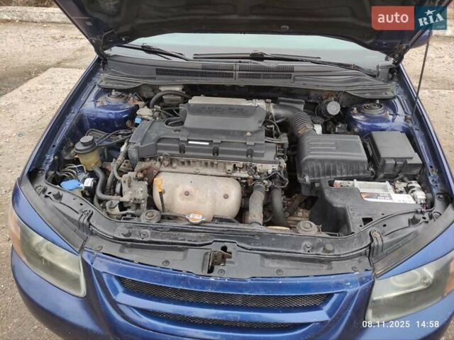 Синий Киа Черато, объемом двигателя 1.98 л и пробегом 246 тыс. км за 4400 $, фото 33 на Automoto.ua